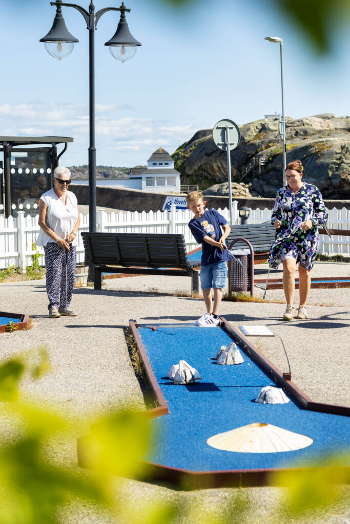 Image: Visitors play miniature golf